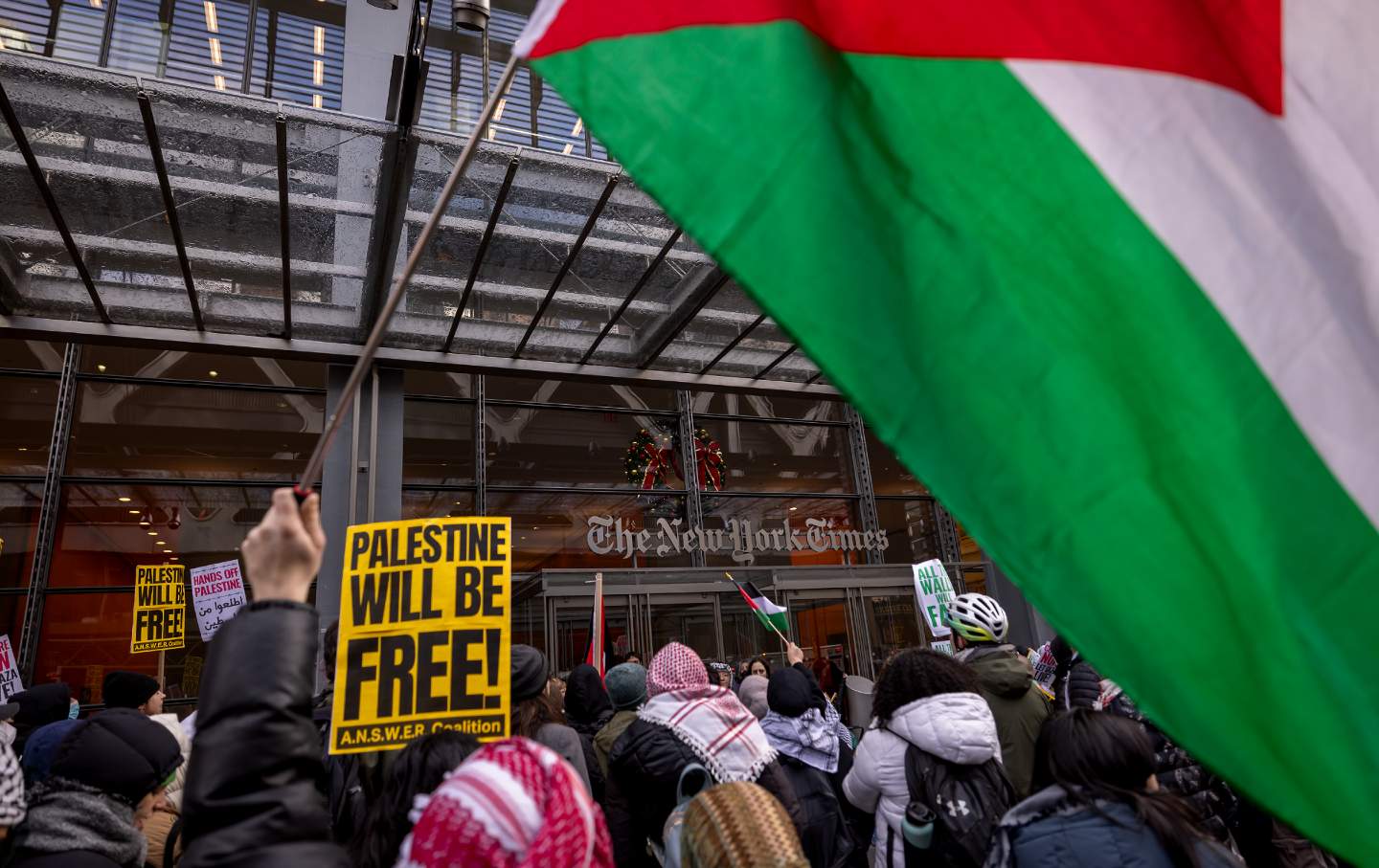 Pro-Palestine protesters gather outside the offices of The New York Times to challenge the newspaper's coverage of the Israel-Gaza war during a global call to 