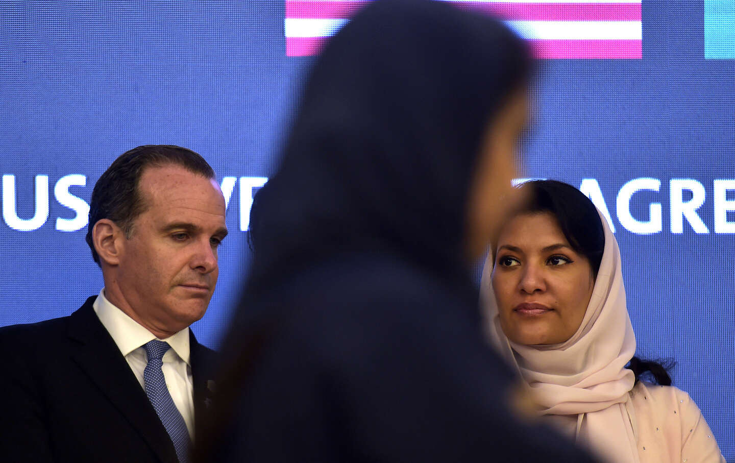 Brett McGurk, US National Security Council coordinator for the Middle East and North Africa, and Princess Reema bint Bandar bin Sultan bin Abdulaziz al-Saud, Saudi ambassador to the US, look on during an investment agreement signing ceremony between the US and Saudi Arabia in the Red Sea coastal city of Jeddah on July 16, 2022.