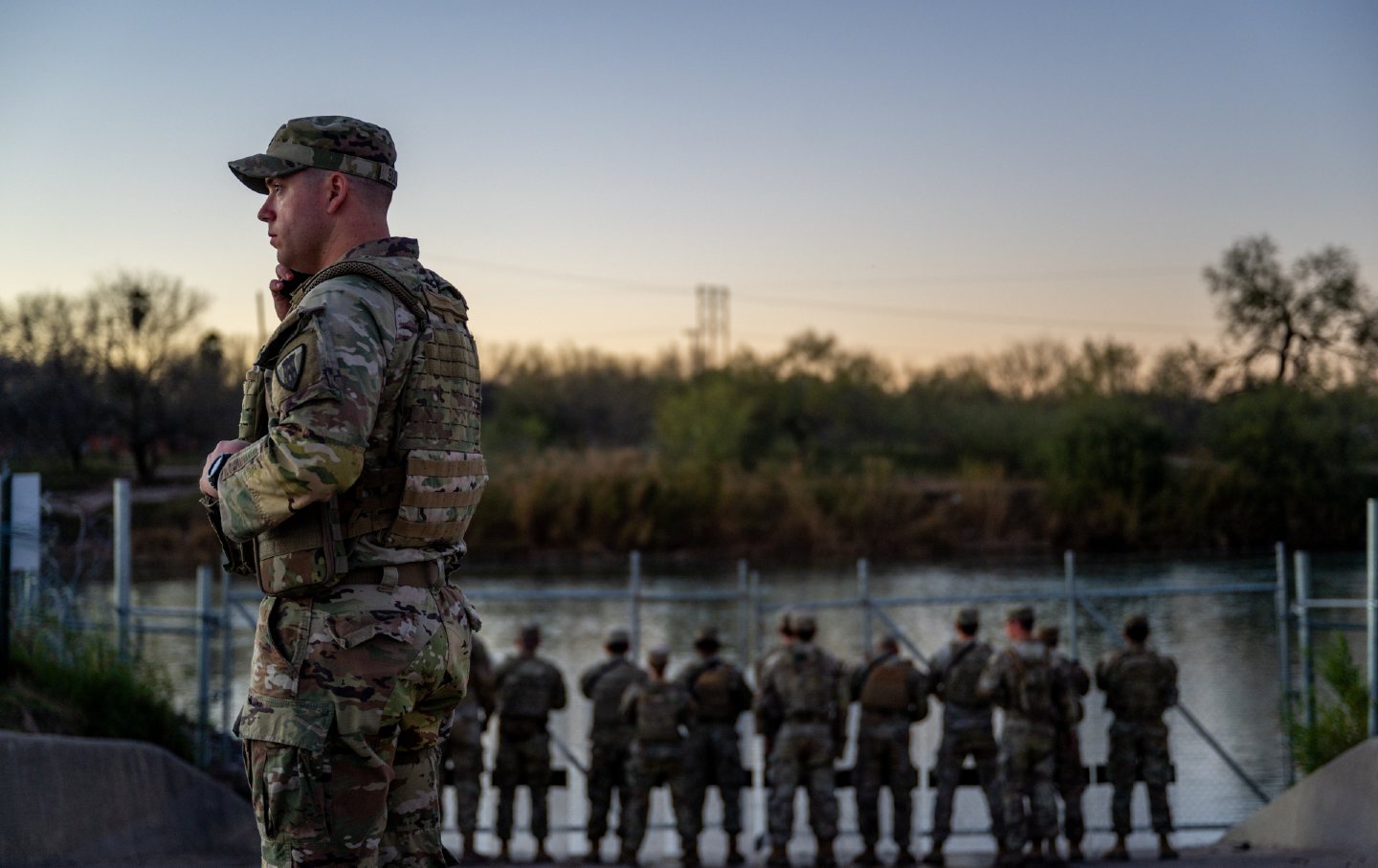 Texas National Guard soldiers stand guard on the banks of the Rio Grande river at Shelby Park on January 12, 2024, in Eagle Pass, Tex.