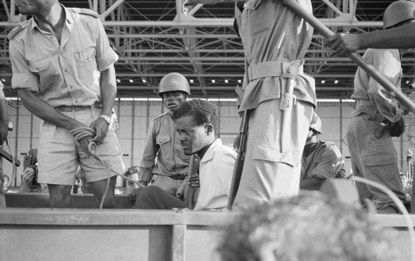 Congo Premier Patrice Lumumba in 1960 crosses the city in a Congolese Army truck after his arrest and return to the captial.