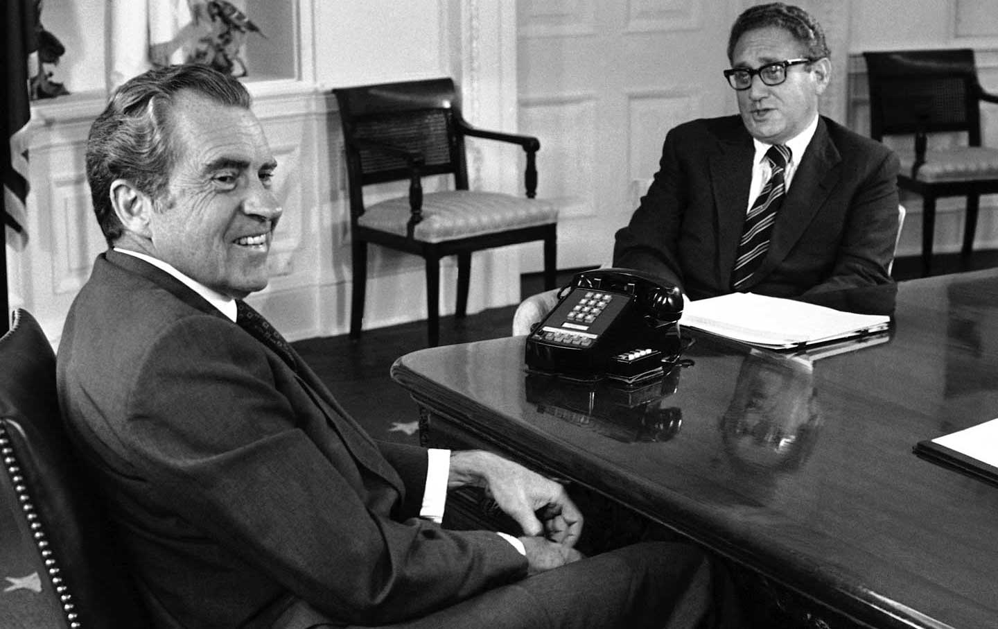 Richard Nixon, left, meets with Henry Kissinger to discuss negotiations following the Paris Peace Accords, Washington, D.C., June 11, 1973.