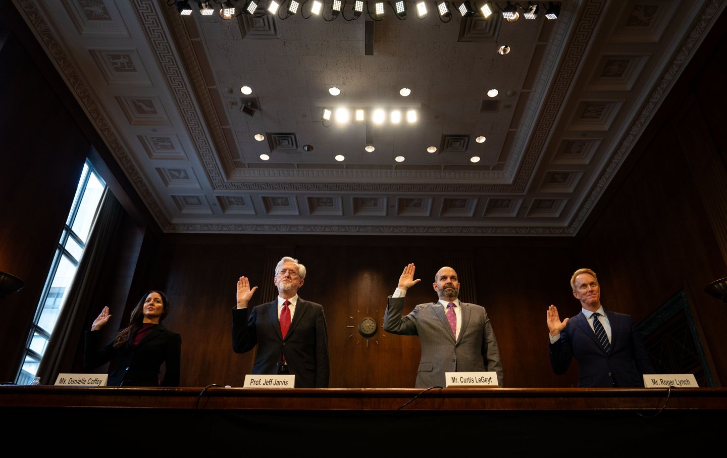 President and CEO of News Media Alliance Danielle Coffey, CUNY Graduate School of Journalism professor Jeff Jarvis, President and CEO of National Association of Broadcasters Curtis LeGeyt, and Condé Nast CEO Roger Lynch are sworn in during a Senate Judiciary Subcommittee on Privacy, Technology, and the Law hearing on “Artificial Intelligence and the Future of Journalism” at the US Capitol on January 10, 2024, in Washington, D.C.
