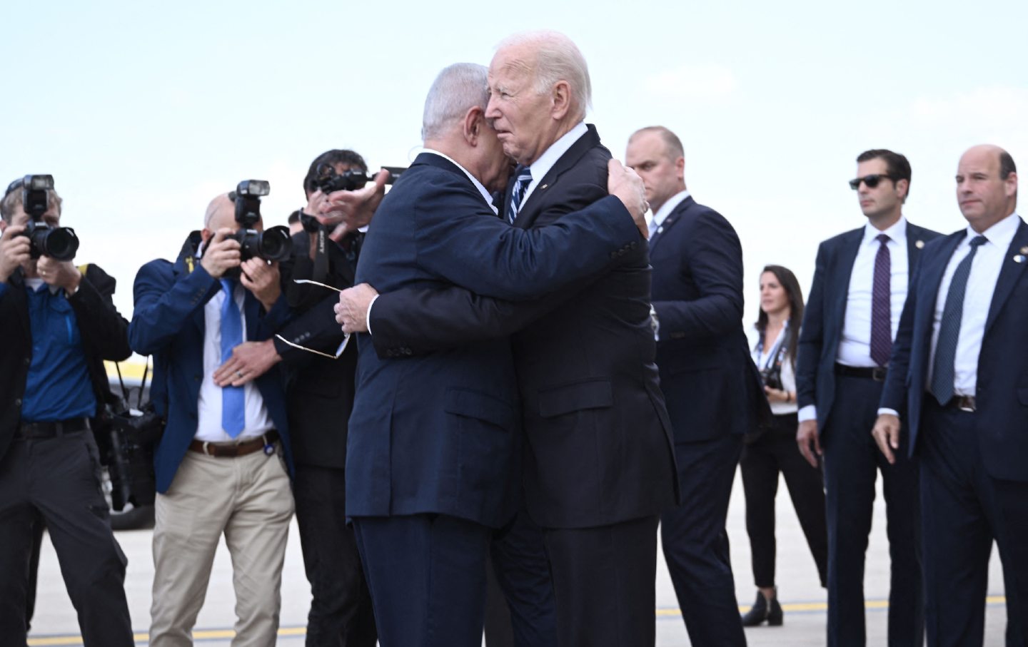 Israel Prime Minister Benjamin Netanyahu (L) hugs Joe Biden upon the US president’s arrival at Tel Aviv's Ben Gurion airport on October 18, 2023. (Brendan Smialowski / AFP via Getty Images)