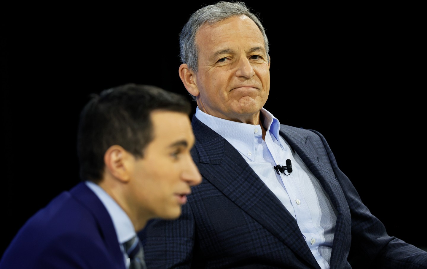 New York Times columnist Andrew Ross Sorkin and Walt Disney CEO Bob Iger speak during the Times’ annual DealBook summit, on November 29, 2023 in New York City.