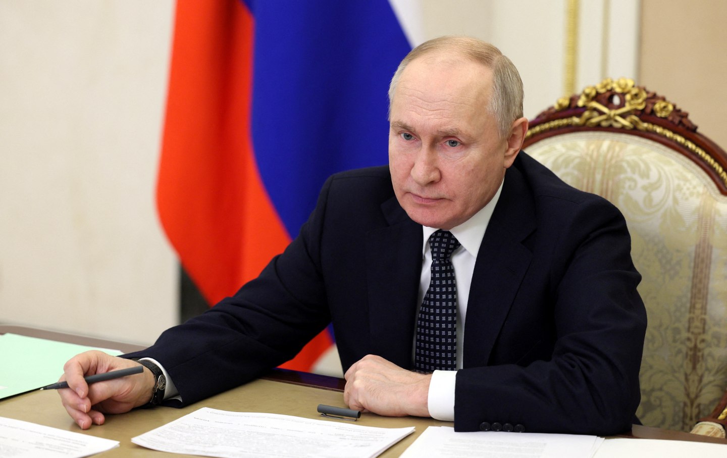 Russian President Vladimir Putin chairs a meeting with Russia's Government members via video link in Moscow, on January 17, 2024.