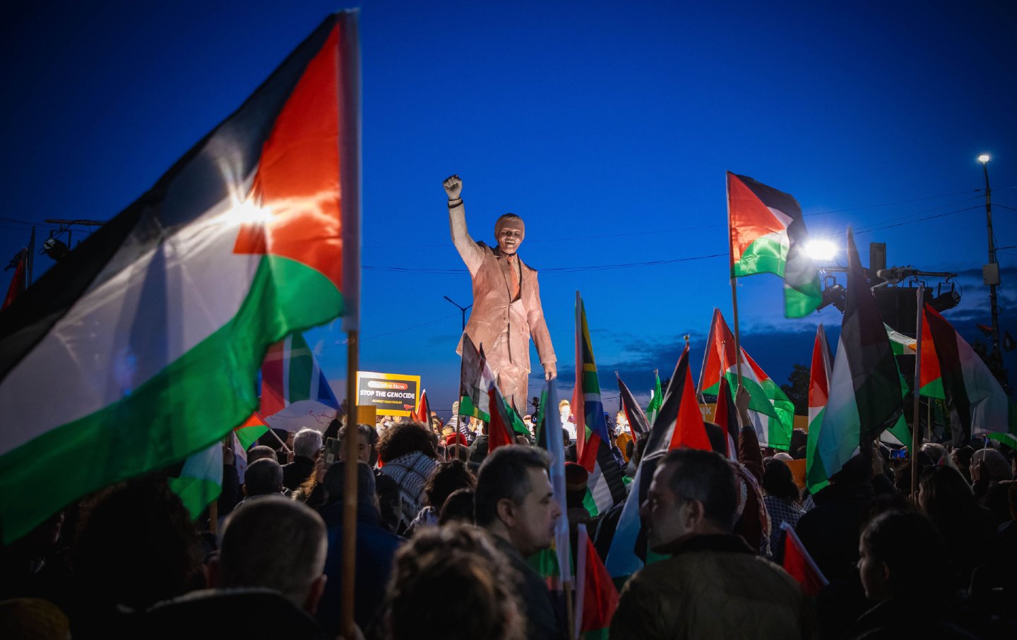 Palestinians carrying flags and banners gather at the Nelson Mandela Square to demonstrate in support of the genocide case filed by South Africa against Israel at the International Court of Justice, on January 10, 2024, in Ramallah, the West Bank.