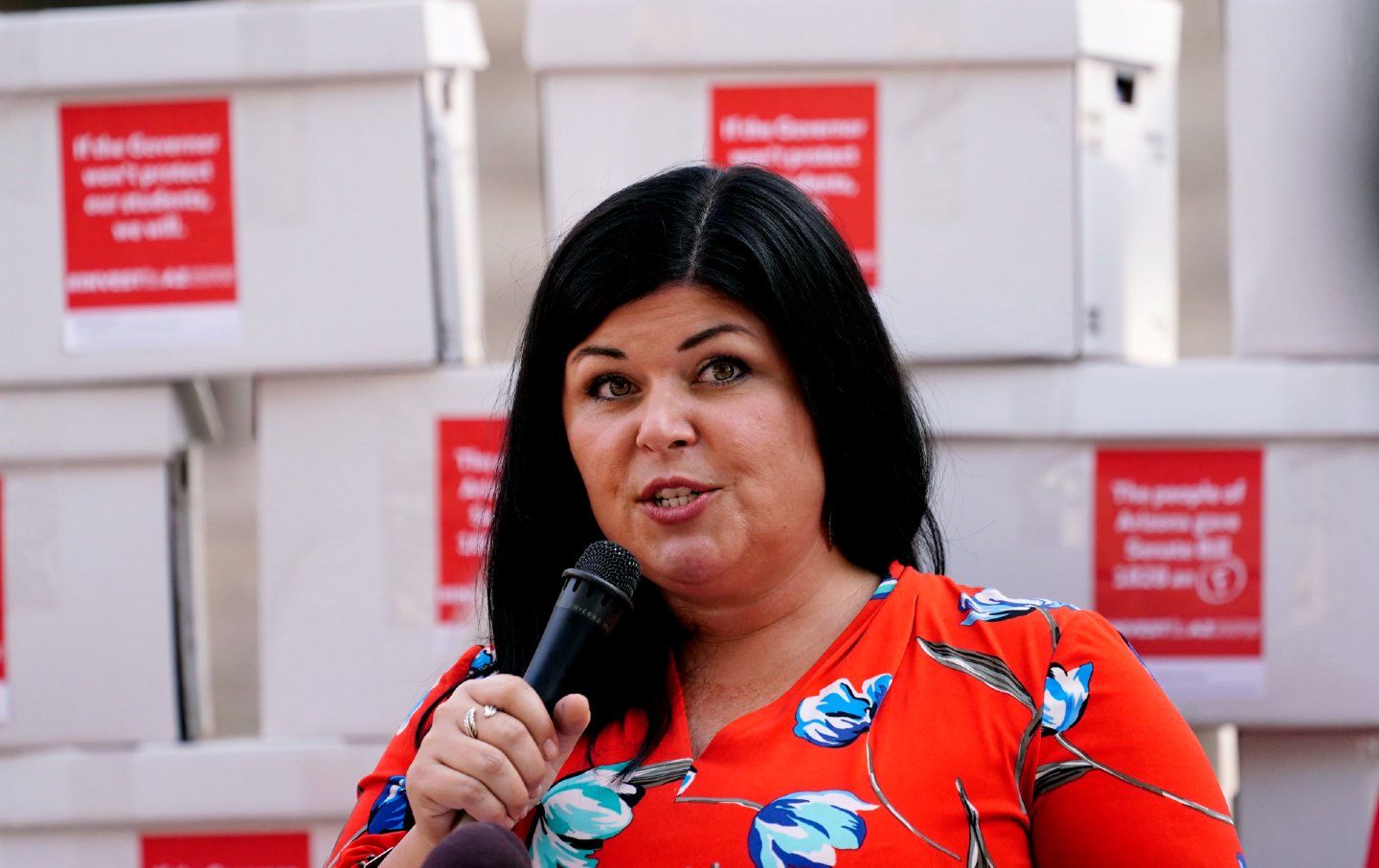 Beth Lewis, Executive Director of Save Our Schools Arizona, speaks out against income tax cuts and election law changes passed by the Arizona Legislature in Phoenix, Arizona on September 28, 2017.