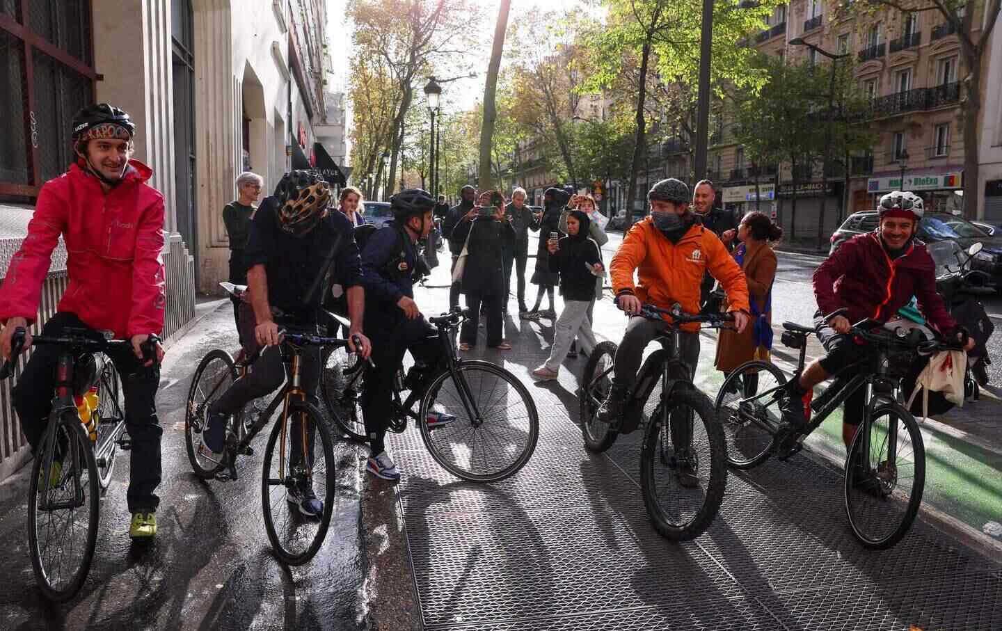 Delivery riders prepare to start “La Grande Livraison,” their bicycle journey from Paris to Brussels to defend their rights, in Paris on November 5, 2023.