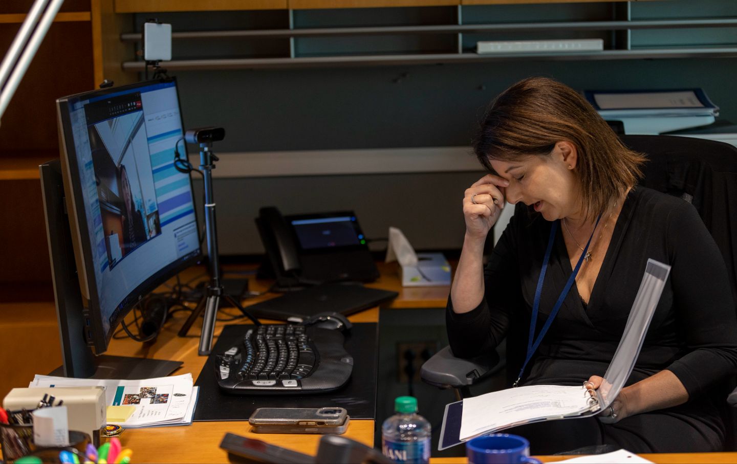 Centers for Disease Control and Prevention Director Dr. Mandy Cohen rubs her head while taking notes during her end-of-day check-in inside her office at the Centers for Disease Control and Prevention headquarters in Atlanta, Georgia, on Thursday, September 21, 2023.