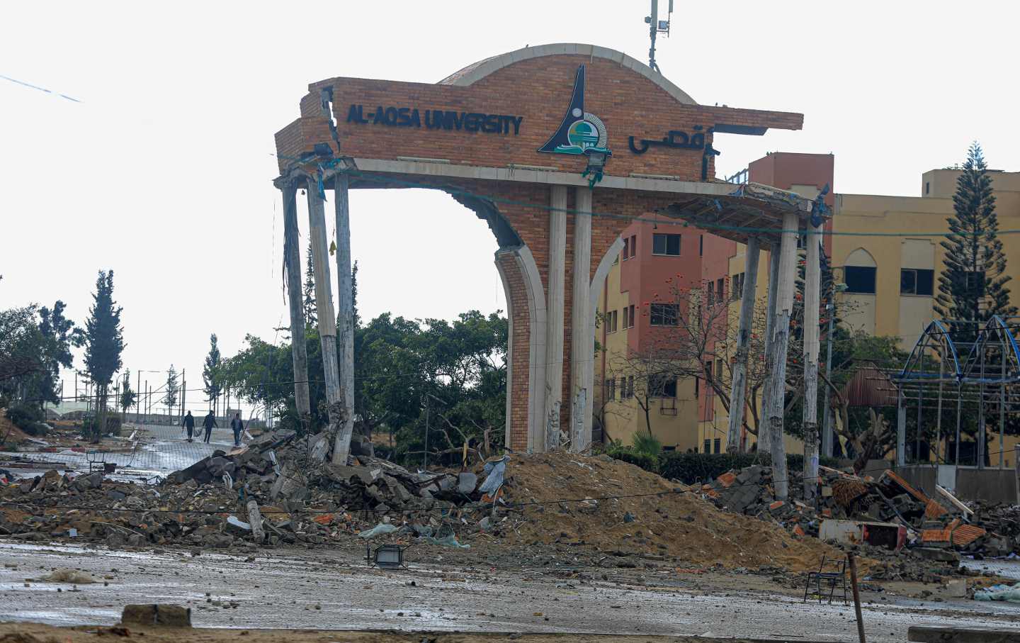 A university gate is seen destroyed in the southern Gaza Strip city of Khan Younis, on Jan. 29, 2024.