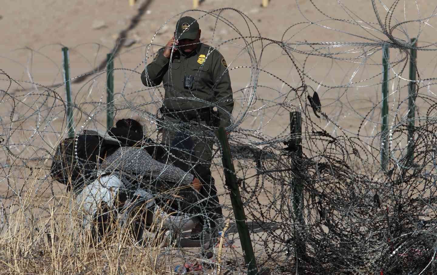 Border patrol officers take security measures as migrants trying to cross the Mexico-United States border to seek humanitarian asylum cut through razor wire despite high security measures in Ciudad Juarez, Mexico on January 31, 2024.