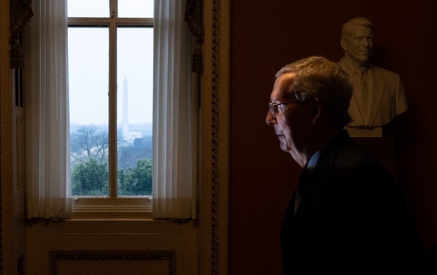 Senate minority leader Mitch McConnell (R-Ky.) walks to his office after a vote in the Senate chamber on Wednesday, February 28, 2024.