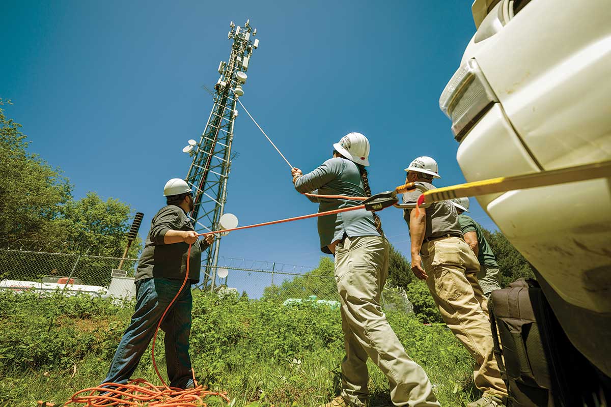 Participants in the seventh Tribal Broadband Bootcamp, hosted by the Hoopa Valley Indian Reservation, take part in a tower climb to better understand their tribal network.