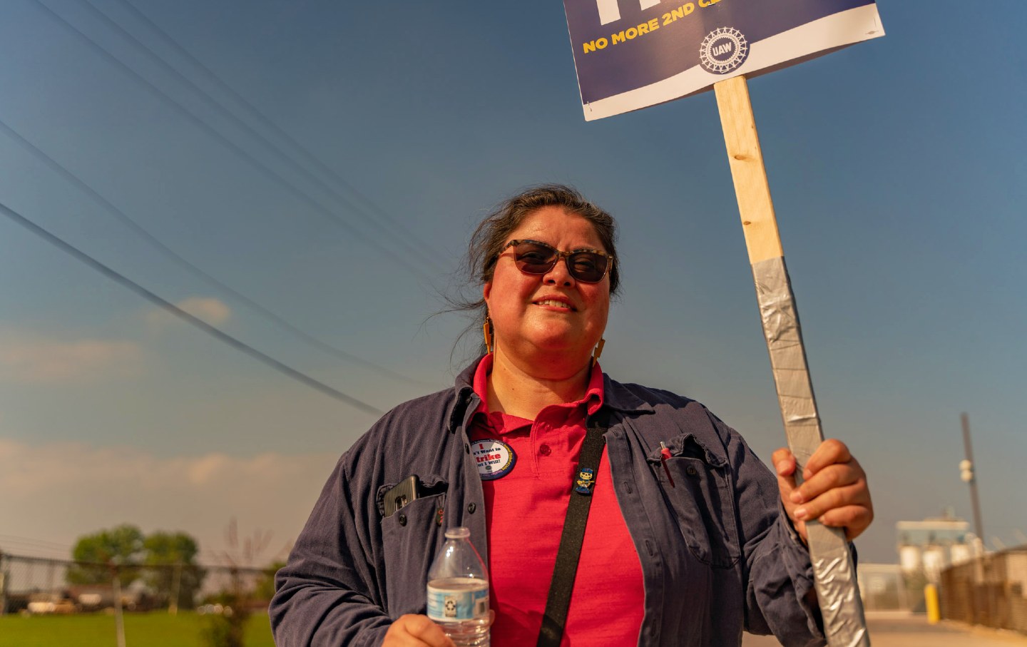 Marcie Pedraza pickets near an entrance to Ford's Chicago Assembly plant during UAW's stand-up strike on September 29, 2023.
