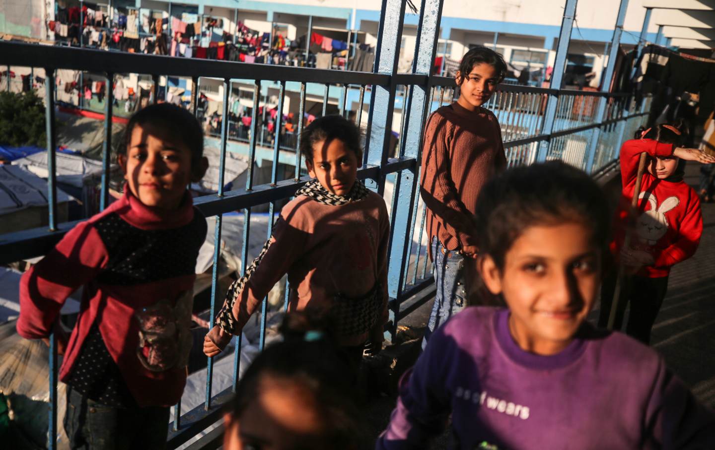 A group of Palestinian children is pictured at a school run by the UNWRA a in Deir Al-Balah in the central Gaza Strip on February 22, 2024.