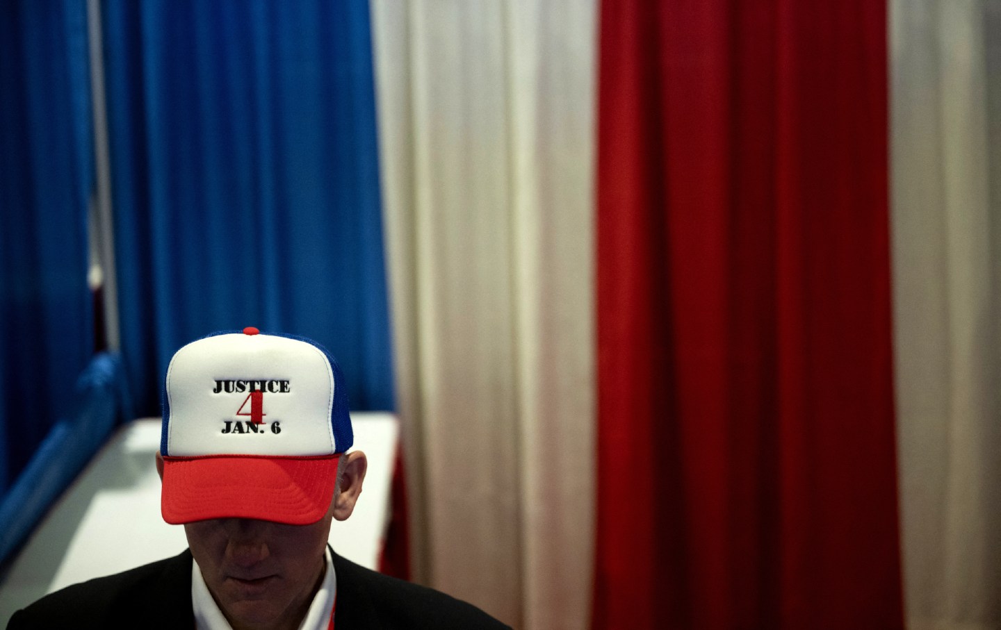 A person wears a hat supporting those arrested for participating in the January 6 US Capitol attack during the annual Conservative Political Action Conference in National Harbor, Md., on February 22, 2024.