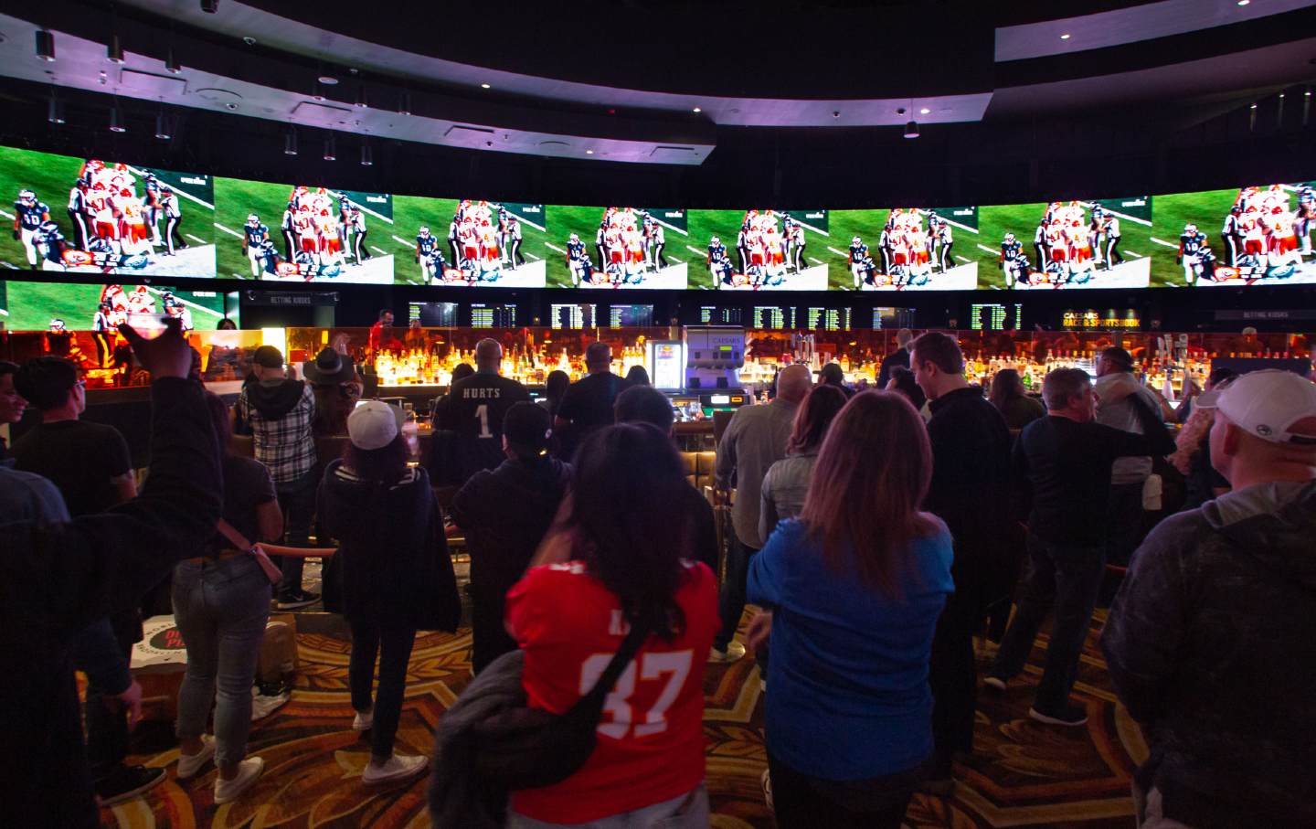 Crowds jam into Caesars Sports Book at Caesars Palace Hotel & Casino to bet on the Kansas City Chiefs vs. Philadelphia Eagles in Super Bowl LVII on February 12, 2023, in Las Vegas, Nev.