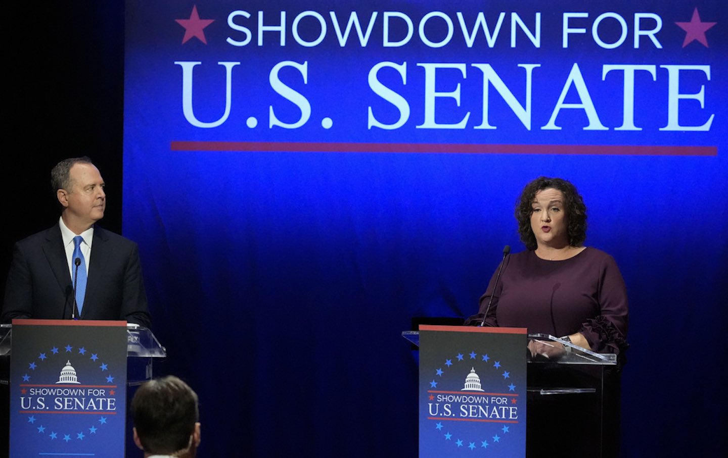 Representative Adam Schiff (D-Calif.) left, looks on as Representative Katie Porter (D-Calif.) speaks during a televised debate for candidates in the senate race to succeed the late Senator Dianne Feinstein, Monday, January 22, 2024, in Los Angeles.