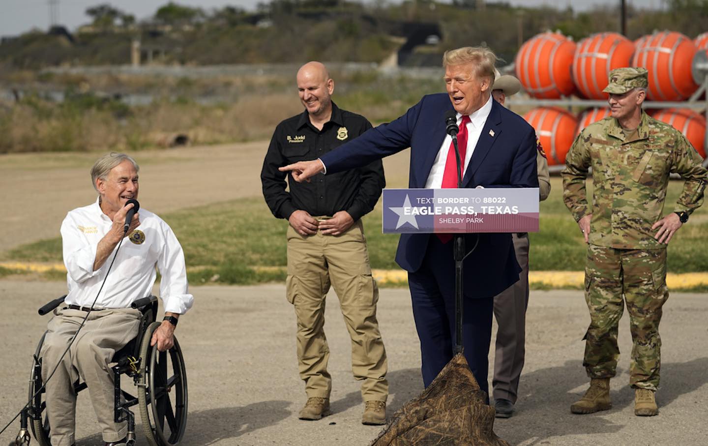 Donald Trump points to Texas Governor Greg Abbott as he speaks at Shelby Park during a visit to the US-Mexico border, Thursday, February 29, 2024, in Eagle Pass, Tex.