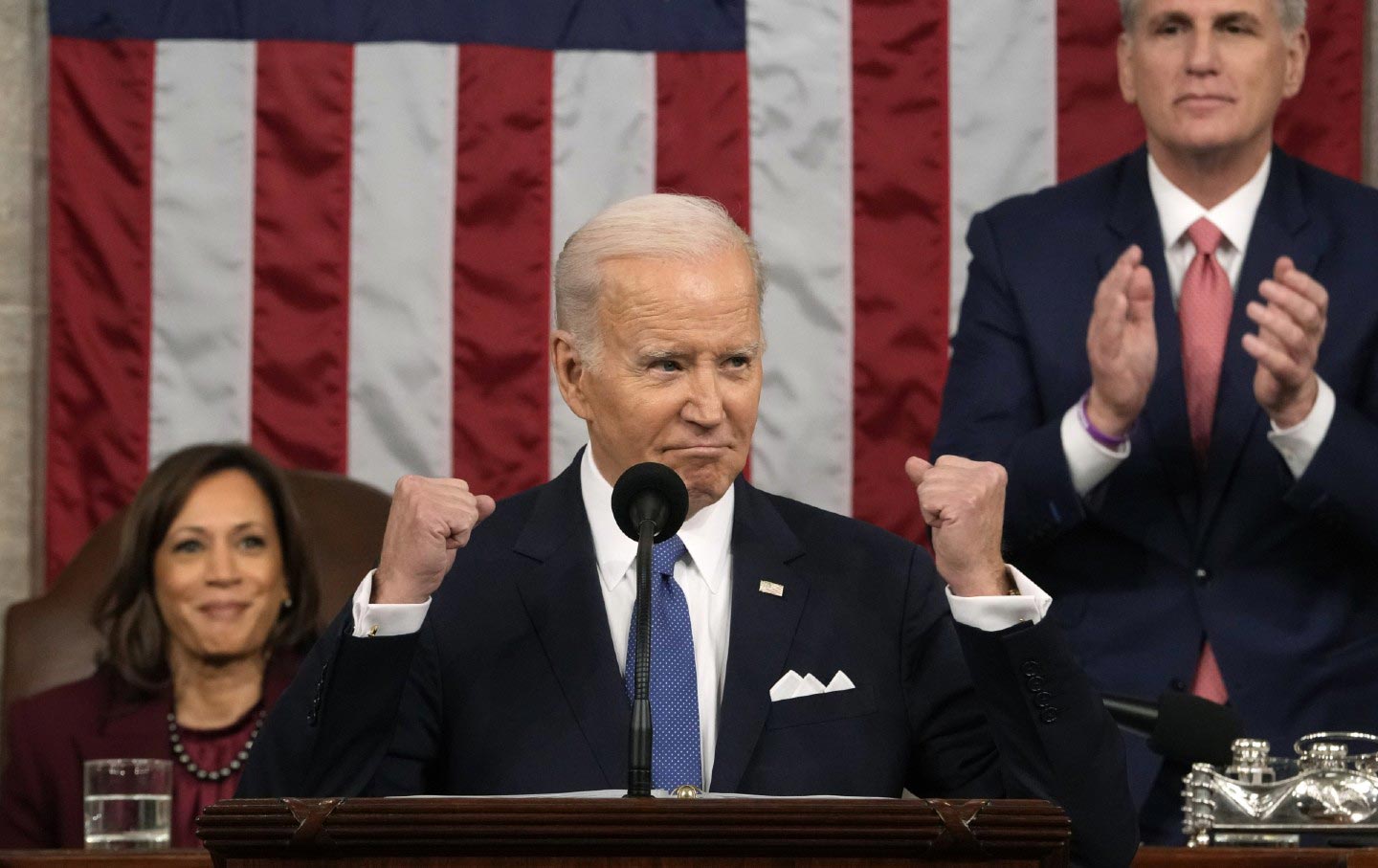 Biden stands at a podium to deliver the State of the Union at the US Capitol