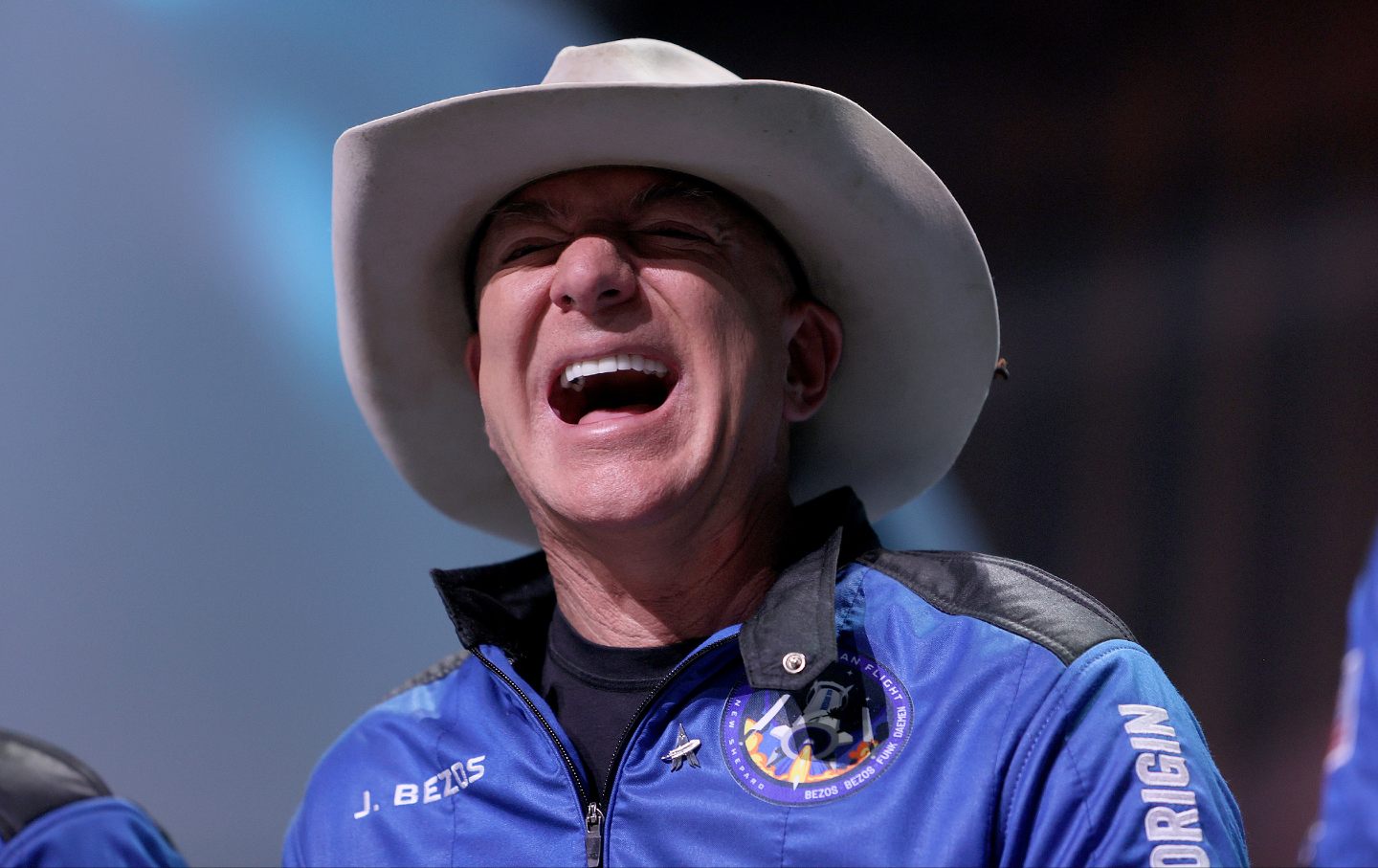 Washington Post owner Jeff Bezos laughs as he speaks about his flight into space on Blue Origin’s New Shepard, during a press conference on July 20, 2021, in Van Horn, Tex.