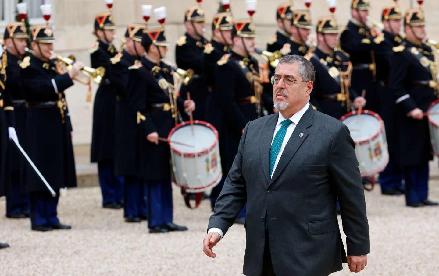 Guatemalan President Bernardo Arevalo walks past the honor guard as he arrives at the Elysée Palace in Paris, France