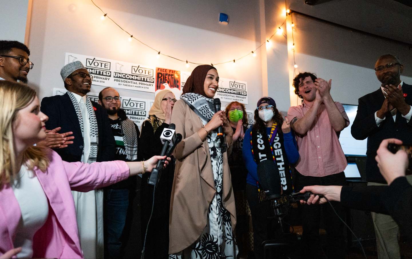 Asma Mohammed (C), an activist with Uncommitted Minnesota, addresses media during a watch party during the presidential primary in Minneapolis, Minnesota on Super Tuesday, March 5, 2024.
