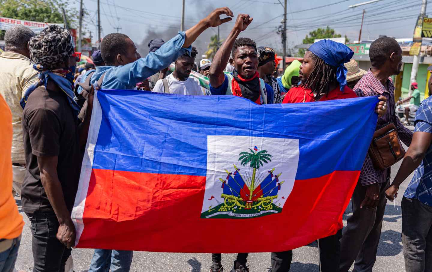 People with a Haitian flag in their hand during a demonstration in Port-au-Prince, Haiti, on March 12, 2024.