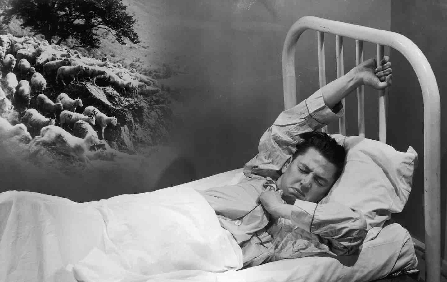 A man fights a losing battle with insomnia by counting sheep, 1940.