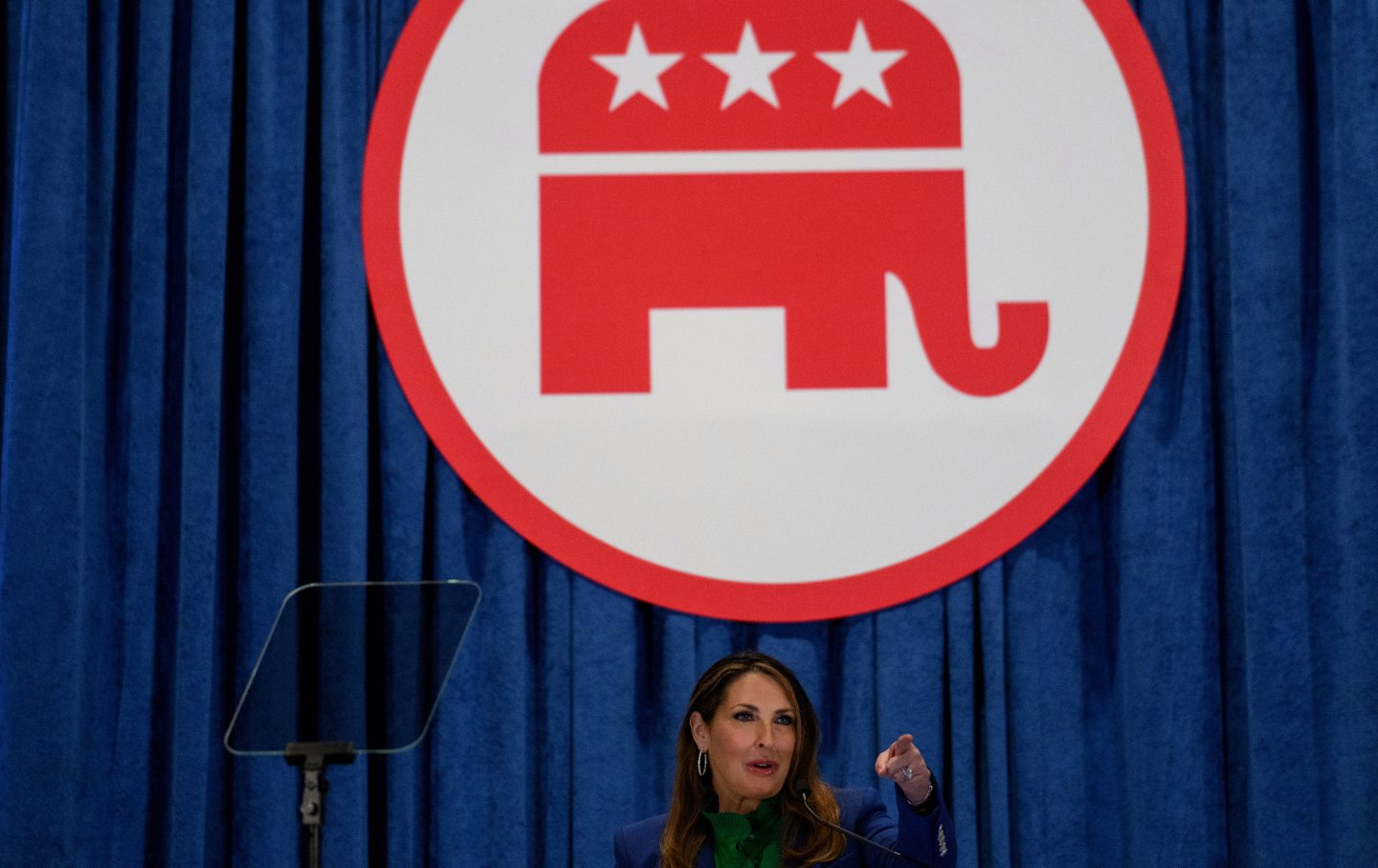 Then-RNC chair Ronna McDaniel under a large poster of a GOP elephant.