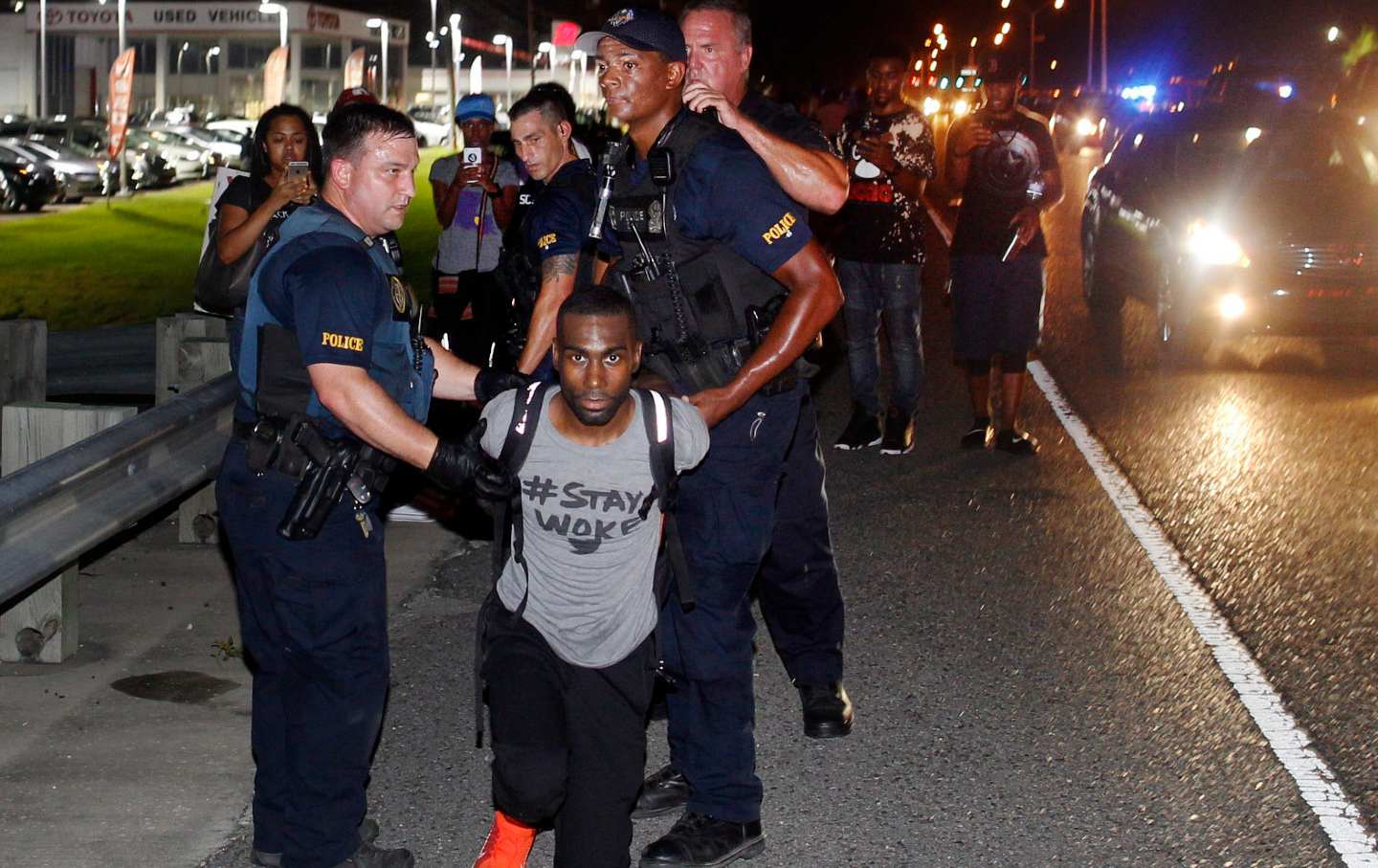 BLM activist DeRay McKesson is arrested during a protest after the murder of Alton Sterling by two white Baton Rouge police officers.