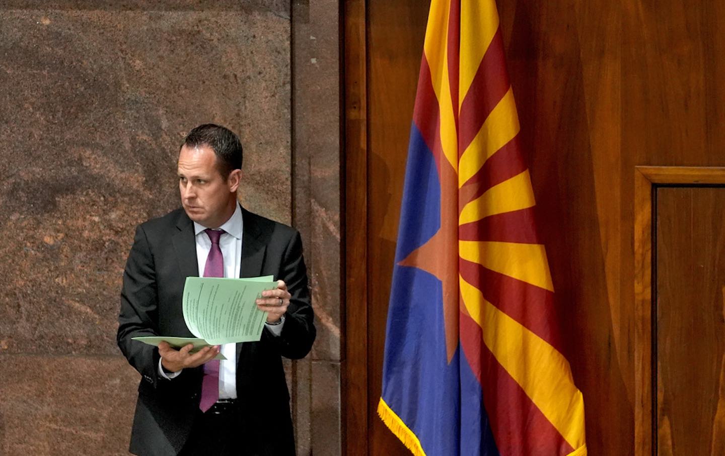 Arizona Republican Representative Travis Grantham looks over documents at the state capitol, Wednesday, April 10, 2024, in Phoenix.
