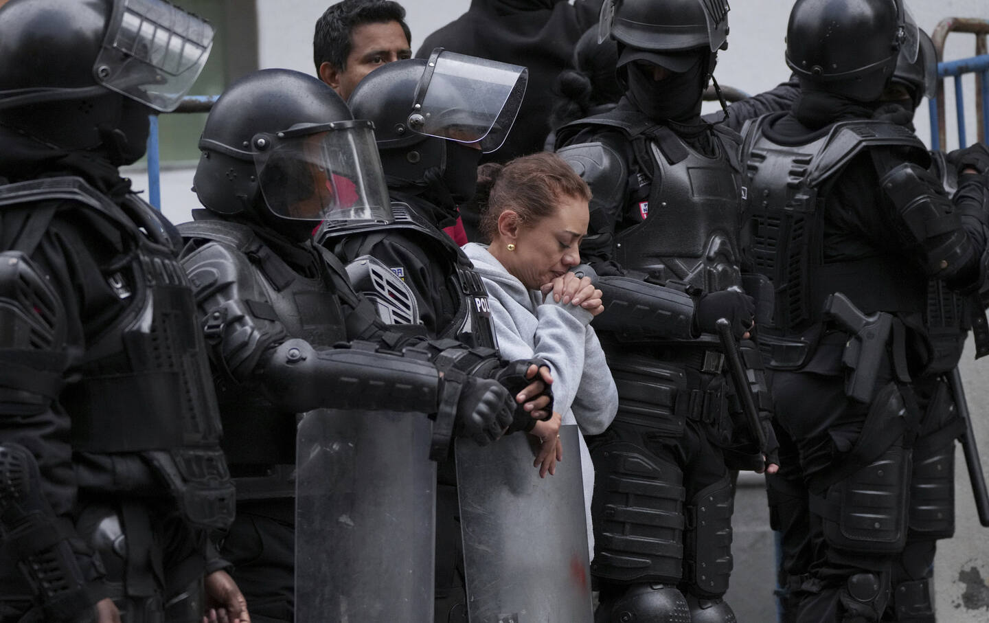 A supporter of former Ecuadorean Vice President Jorge Glas stands outside the detention center where he was taken after police broke into the Mexican Embassy to arrest him, in Quito, Ecuador, April 6, 2024.