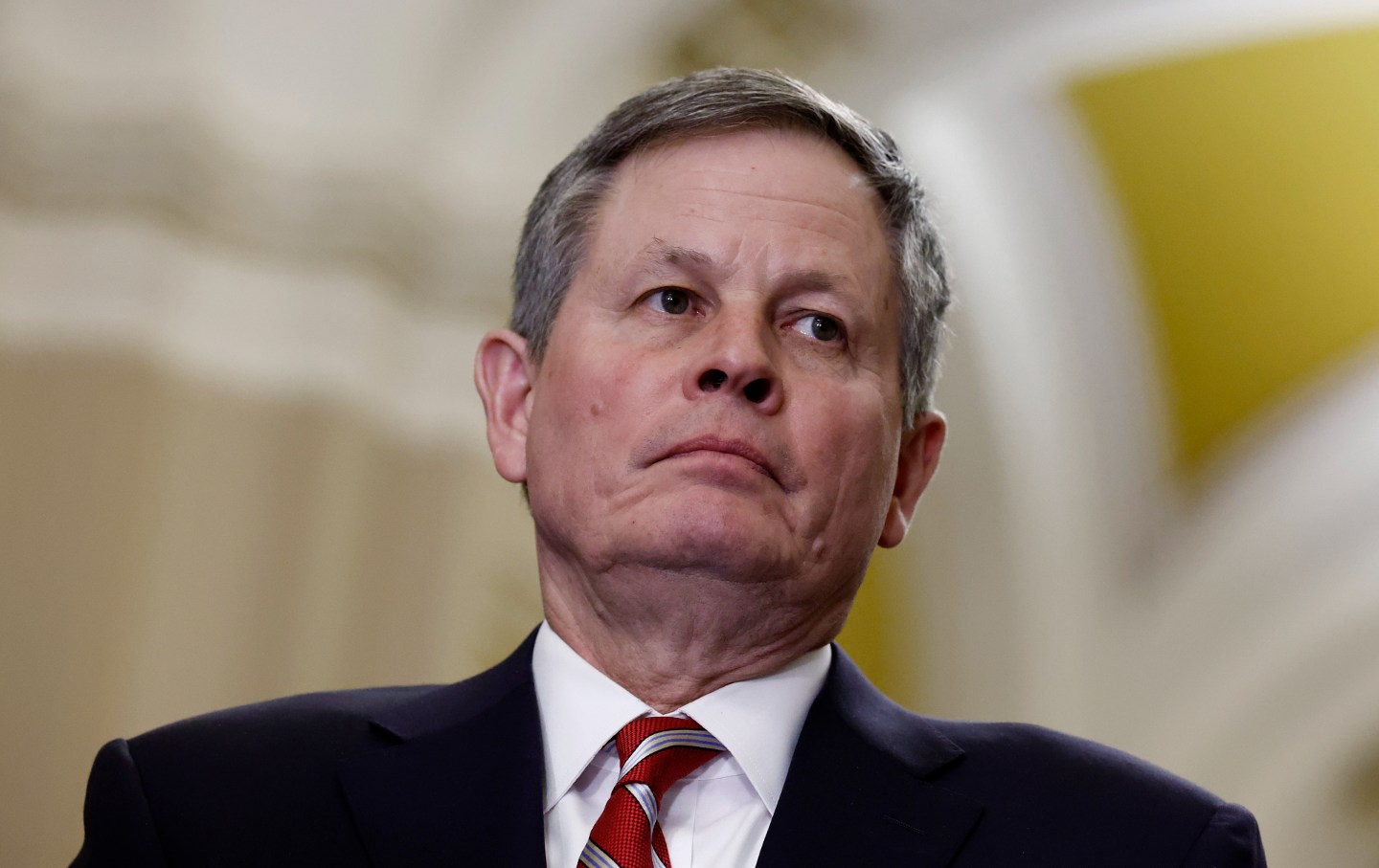 Sen. Steve Daines (R-MT) listens during a news conference following a Senate Republican policy luncheon at the U.S. Capitol building on March 20, 2024.