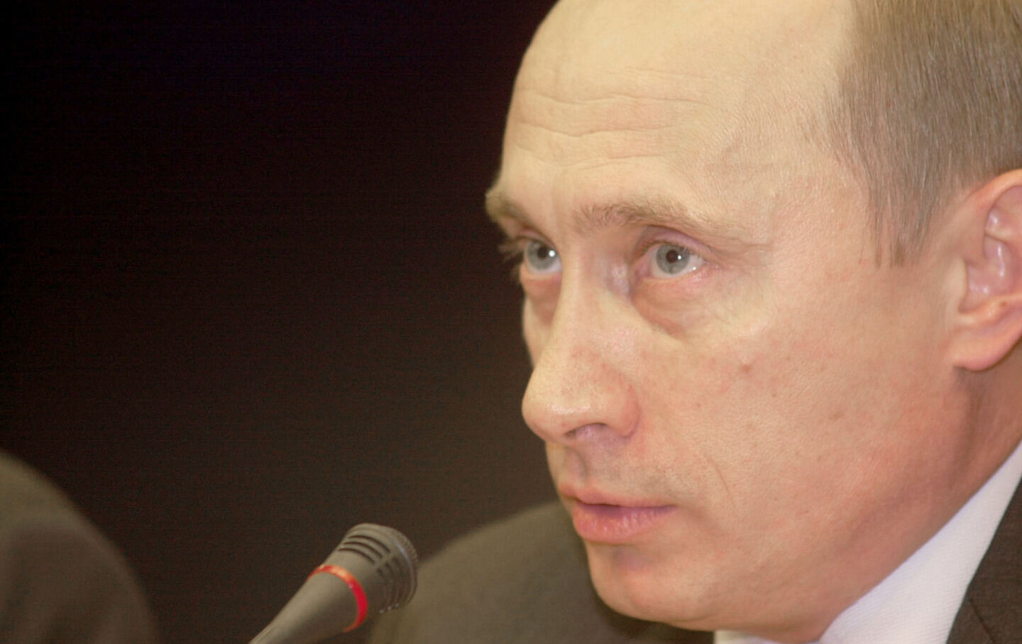 Russian President Vladimir Putin speaks at a press conference following the EU-Russia summit on November 11, 2002, in Brussels, Belgium.