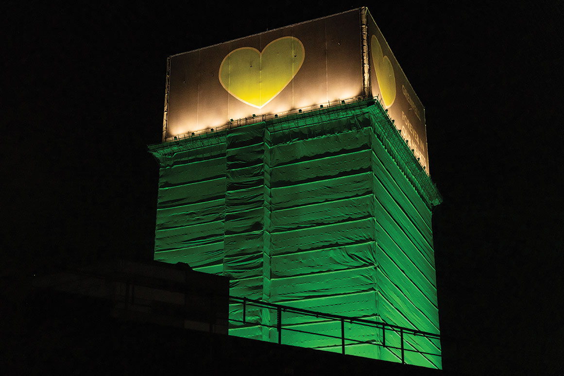 The Grenfell Tower during a memorial event attended by survivors and supporters.