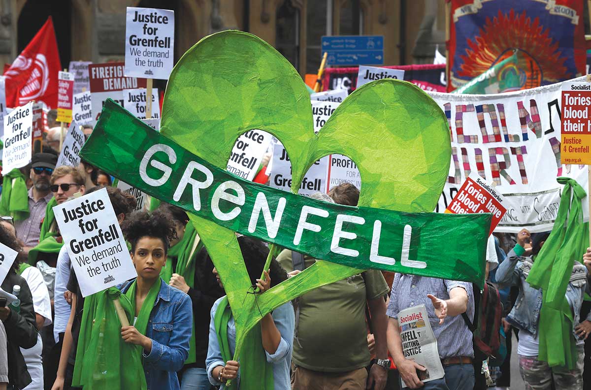 Demonstrators in a solidarity march on the one-year anniversary of the Grenfell fire.