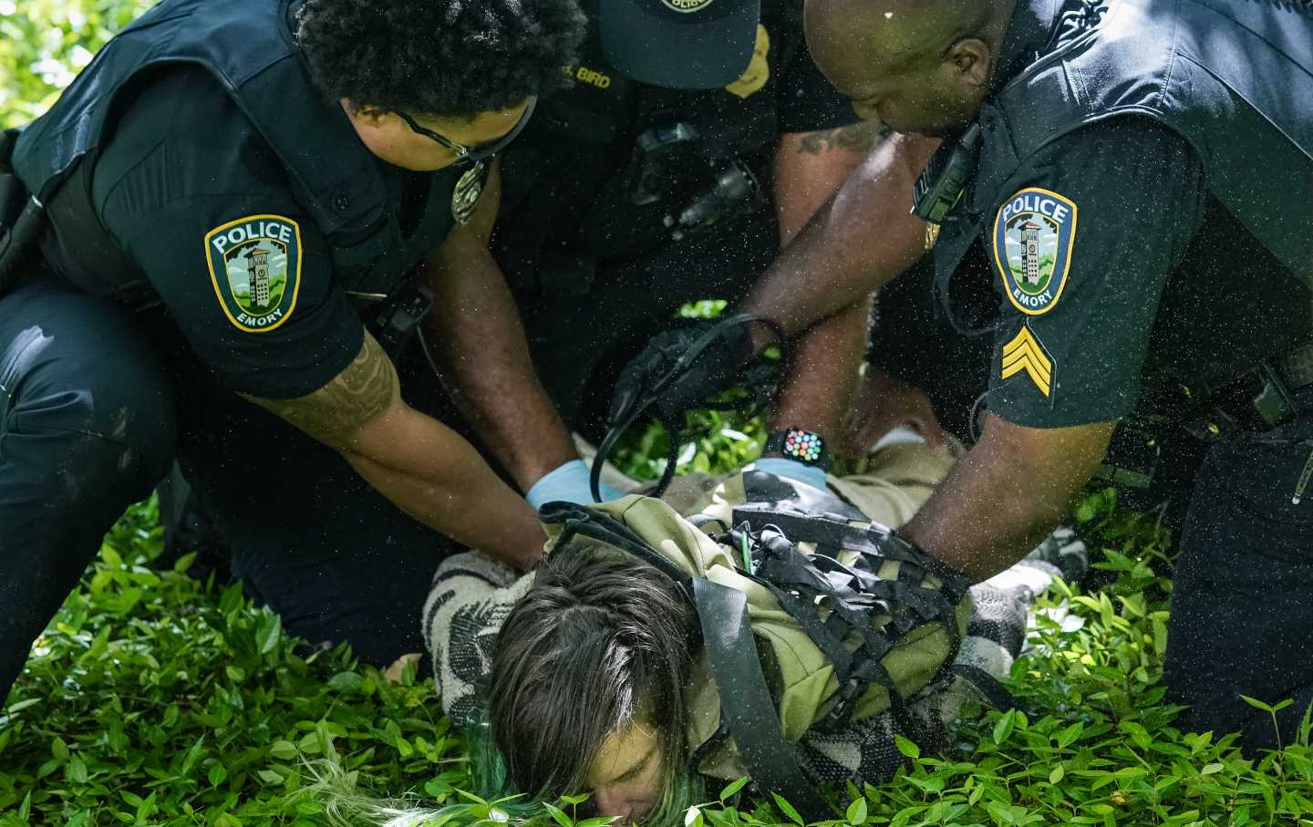 Police officers detain a demonstrator during a pro-Palestinian protest against the war in Gaza at Emory University on April 25, 2024, in Atlanta, Georgia.