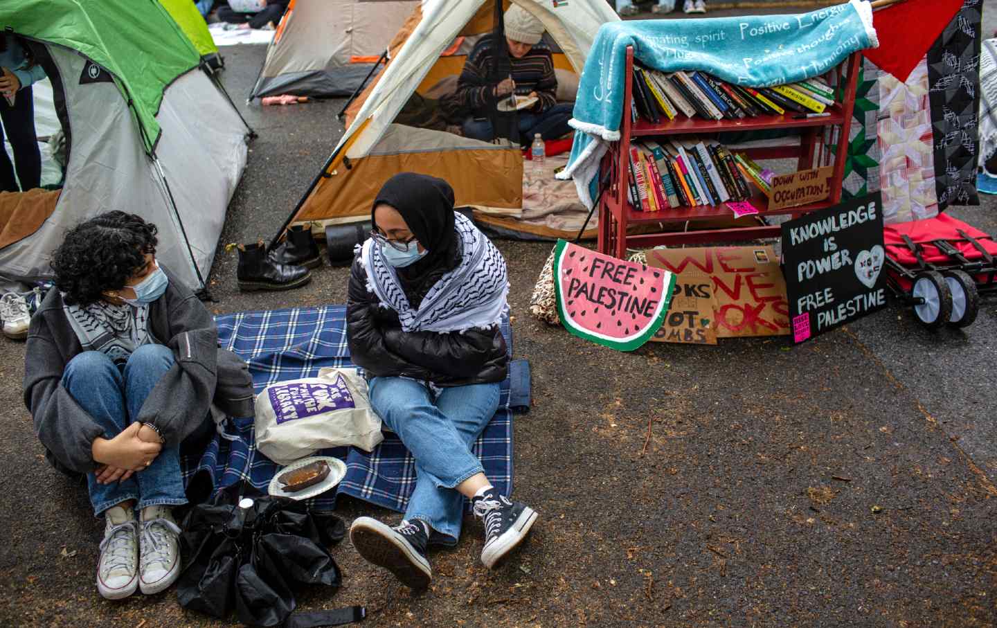 Students set up an encampment in solidarity with Palestine at George Washington University with other area universities in Washington, DC, on April 27, 2024.