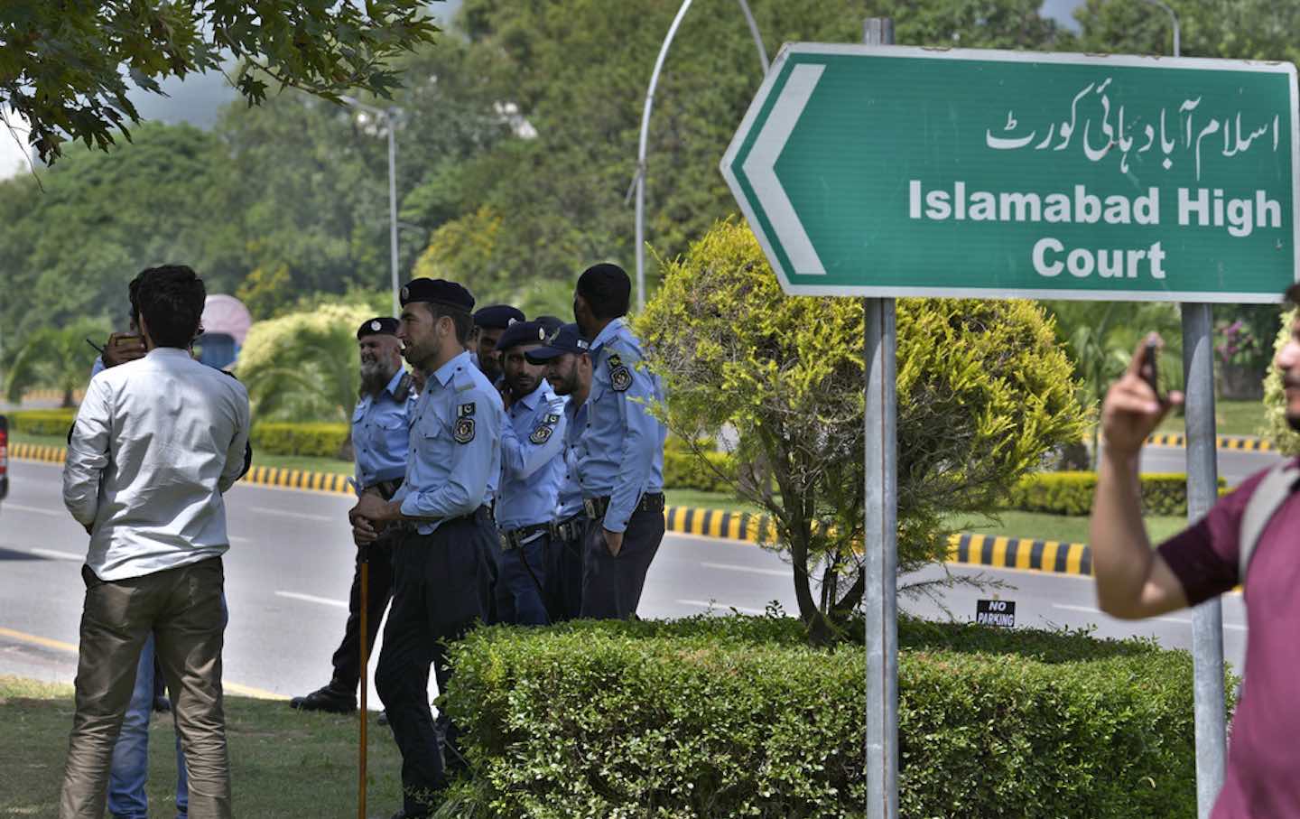 Police officers stand guard outside the Islamabad High Court in Islamabad, Pakistan, in August 2023.