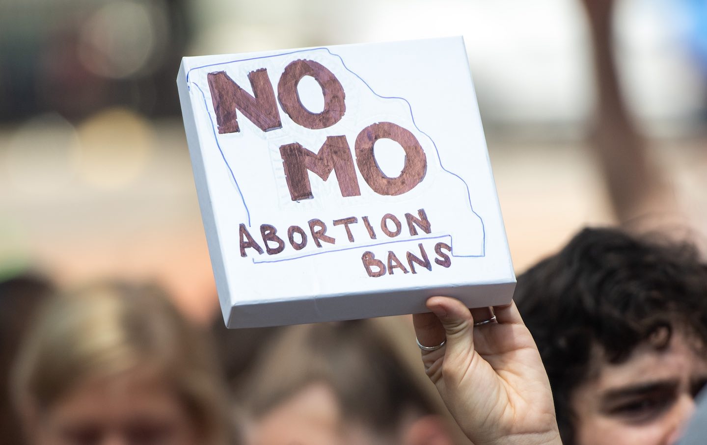 An abortion-rights protester holding a “No MO Abortion Bans” sign at a pro-choice rally in St. Louis, Missouri, on May 30, 2019.