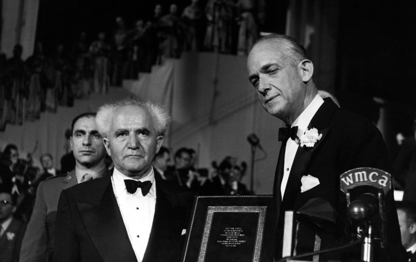 Israel’s first prime minister, David Ben-Gurion (left), is presented with an honour roll of names of the first subscribers to the new Israel Independence Bond issue by American businessman Rudolf Sonneborn (right) at Madison Square Garden in New York City, on May, 1951.