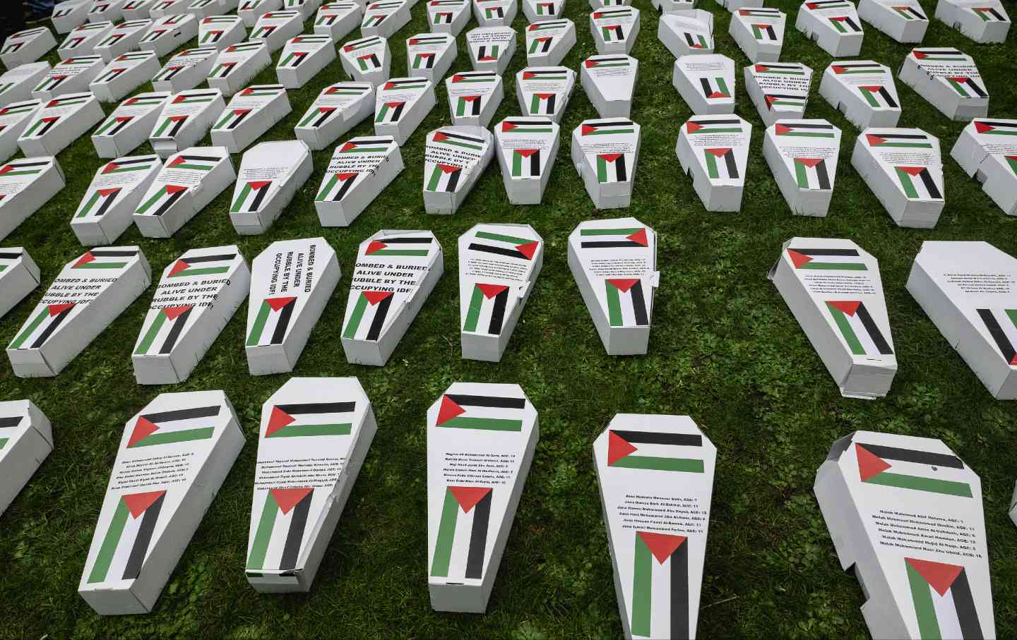 Symbolic coffins are laid out as Health Workers for Palestine march from St Thomas' Hospital to a rally at Downing Street in support of healthcare professionals in Gaza on February 10, 2024, in London, England.