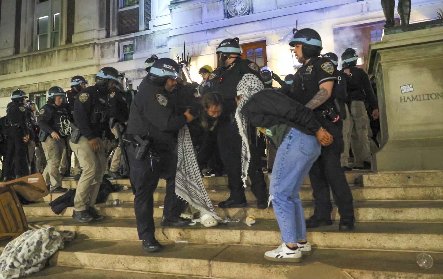 New York Police Department officers detain dozens of pro-Palestinian students at Columbia University after they barricaded themselves at the Hamilton Hall building near Gaza Solidarity Encampment earlier in New York, United States on April 30, 2024.