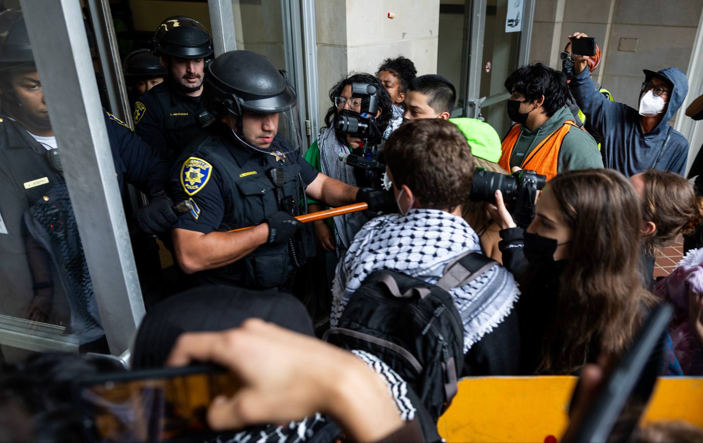 Pro-Palestinian protesters face off with the police in a demonstration at the University of California Los Angeles (UCLA) on May 23, 2024 in Los Angeles, California.