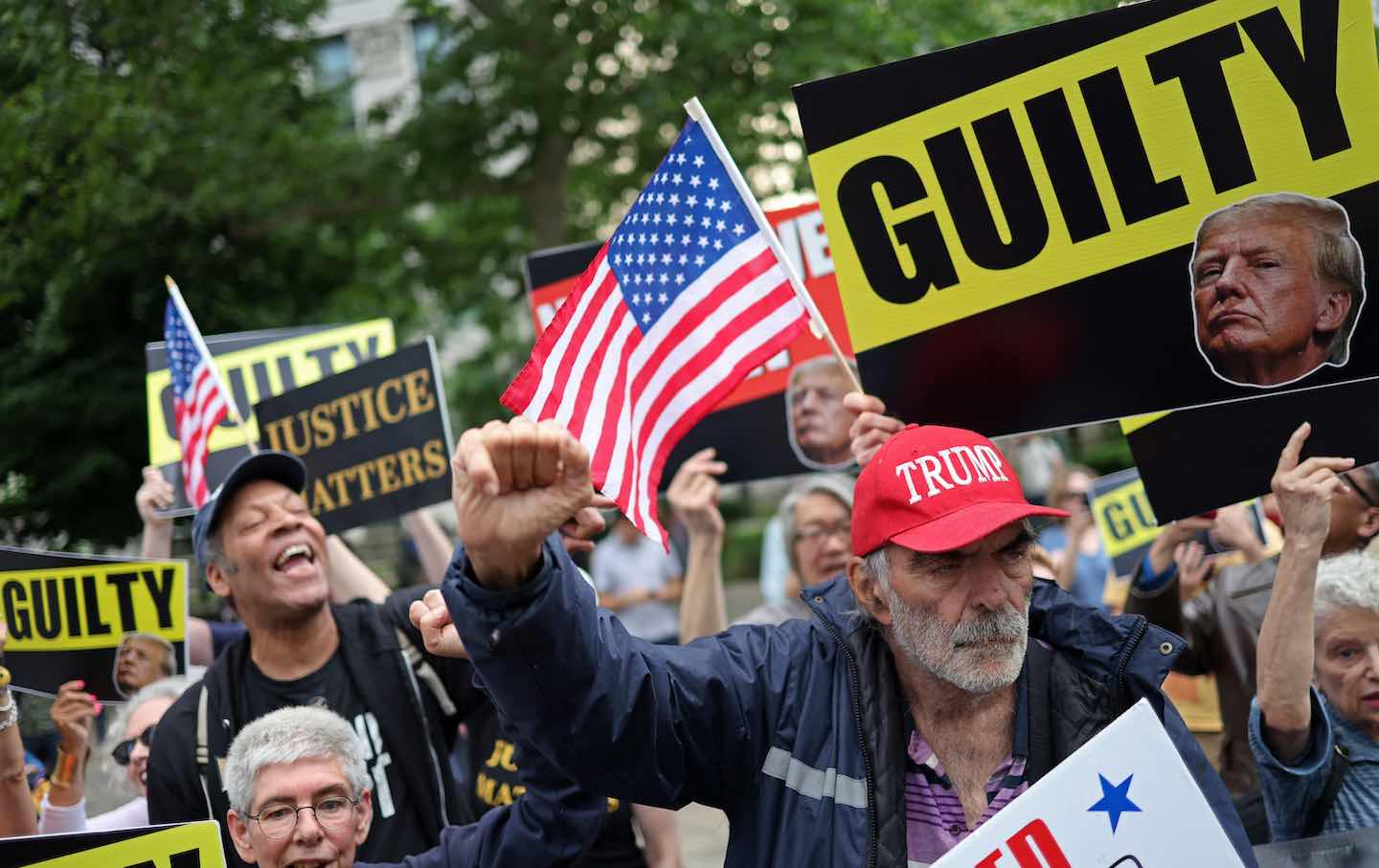 People react after former US president and Republican presidential candidate Donald J. Trump was convicted in his criminal trial outside of Manhattan Criminal Court in New York City on May 30.