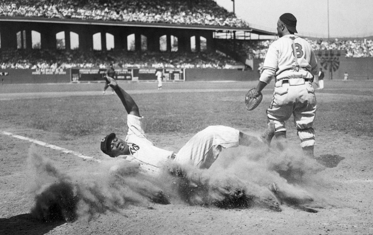 Josh Gibson slides into home plate