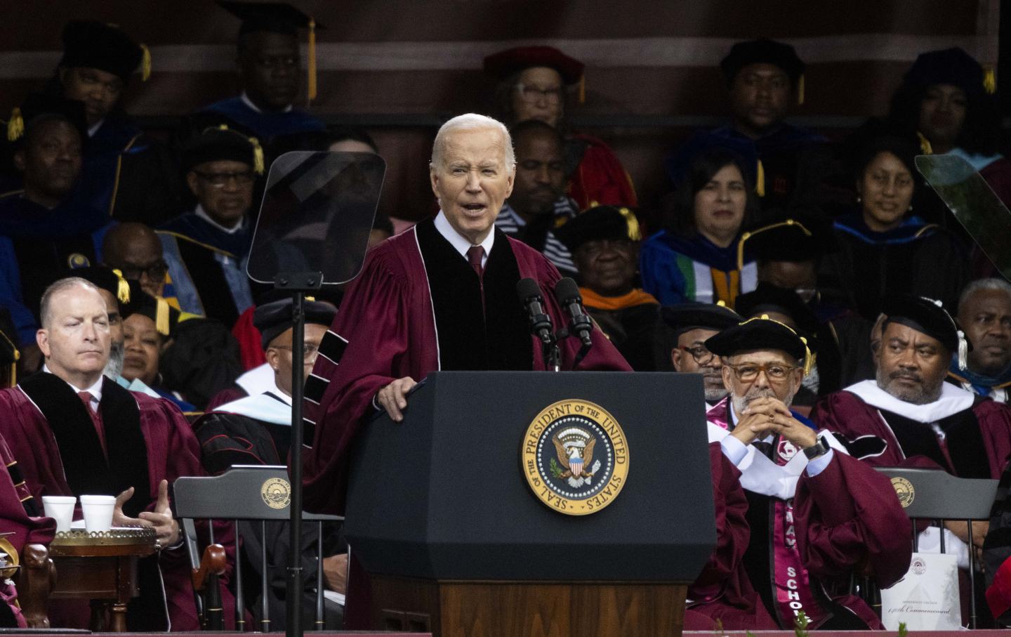 Joe Biden in academic regalia, in front of a crowd of university faculty and staff, giving the commencement address at Morehouse College.