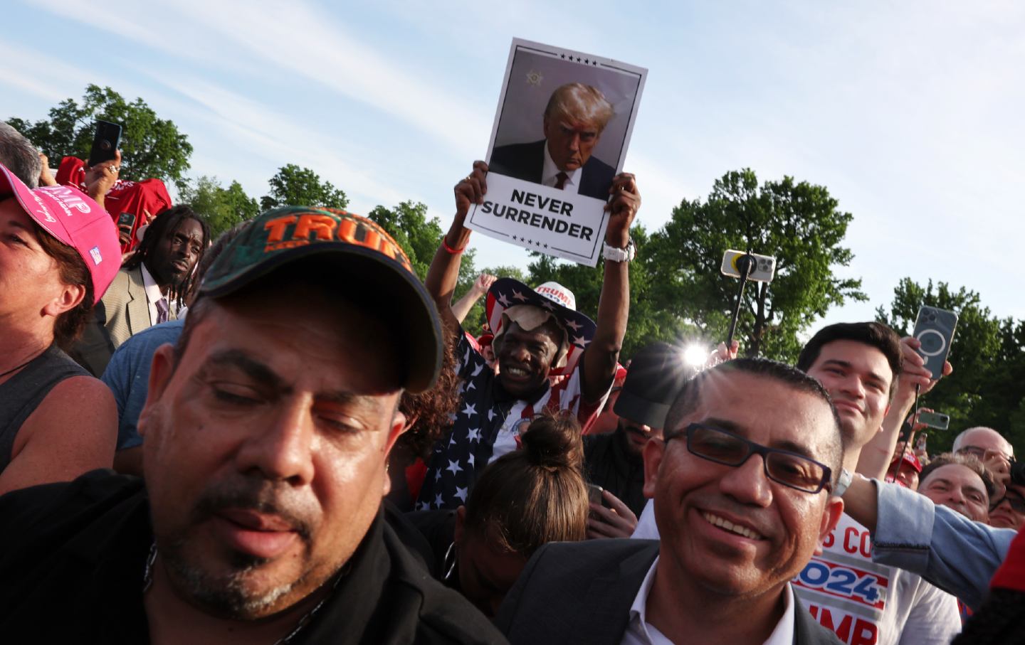 Supporters of former president Donald Trump watch as he holds a rally in the South Bronx on May 23, 2024, in New York City. The Bronx, home to a large Latino community, has been a Democratic base for generations of voters and the rally comes as Trump looks to attract more non-white voters.