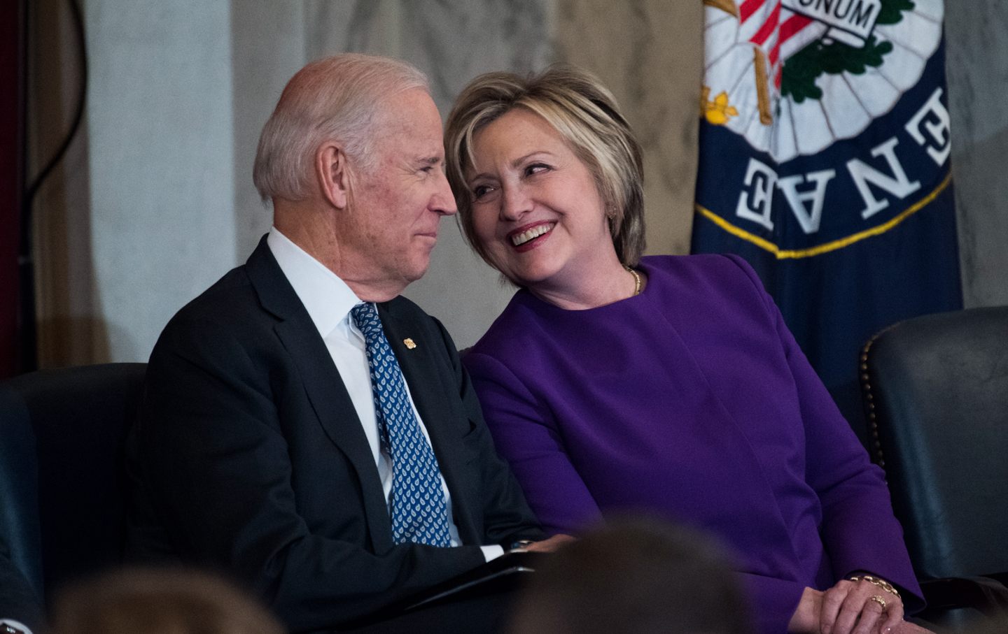 Joe Biden and Hillary Clinton attend a portrait unveiling ceremony in the Russell Senate Office Building on December 8, 2016.